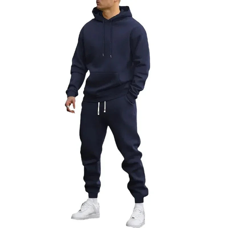 Men's navy blue hoodie and joggers tracksuit set with white sneakers