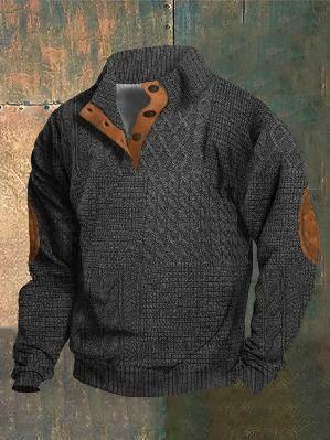 Men's dark grey cable knit sweater with brown elbow patches and button-up collar