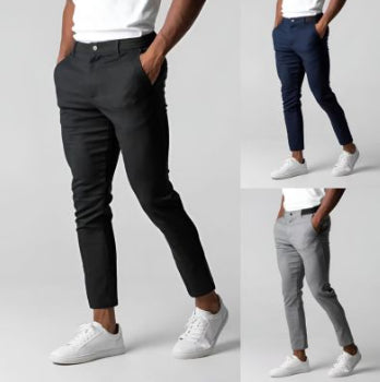 Three different pairs of pants worn by a person on a gray background
