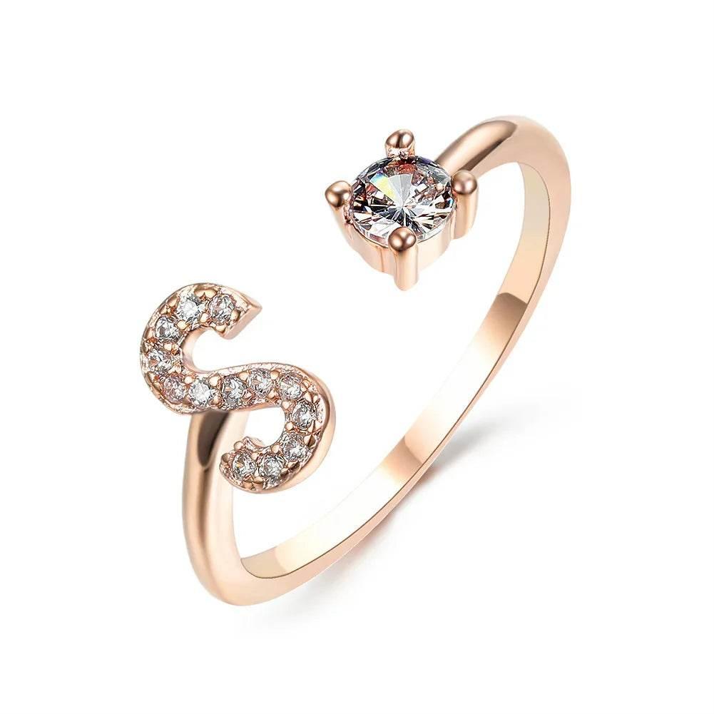 Rose gold open ring with cubic zirconia letter S and clear gemstone accent