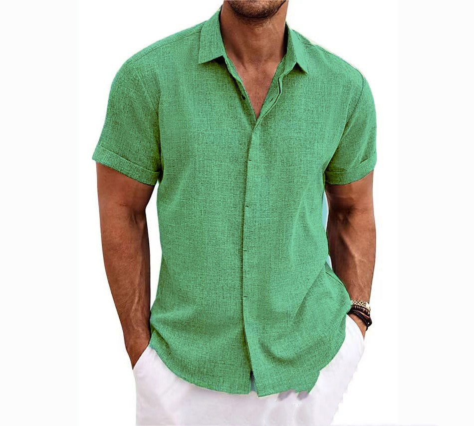 Man wearing a green short-sleeve shirt on a white background