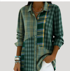 A woman wearing a green plaid button-up shirt with yellow and white stripes, paired with white pants, shown against a light gray background.