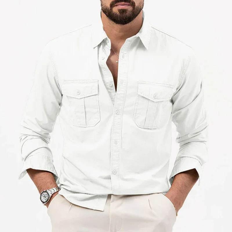 Man wearing white button-up shirt with long sleeves and front pockets, stylish casual fashion.