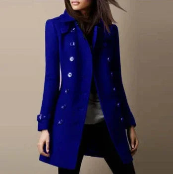 Woman wearing a trendy royal blue double-breasted coat, elegant fall fashion outerwear.