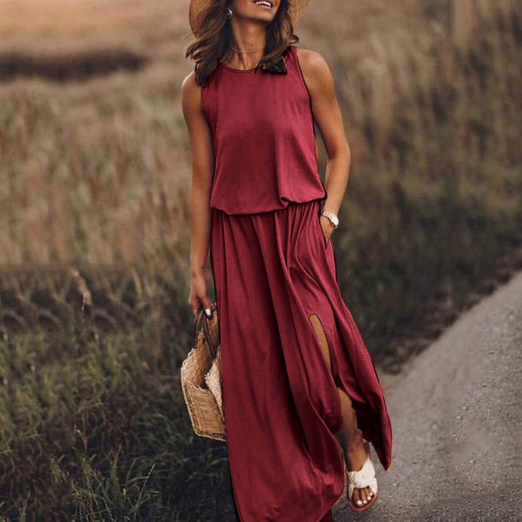 Woman in a red dress walking on a path with a field in the background