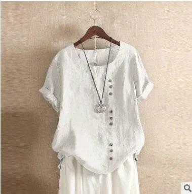 Women’s casual white short sleeve blouse with side buttons and round neckline on hanger