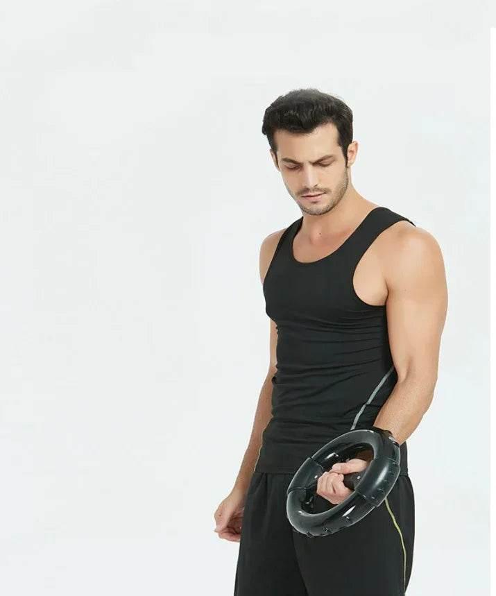 Man in black athletic wear holding fitness resistance ring on white background
