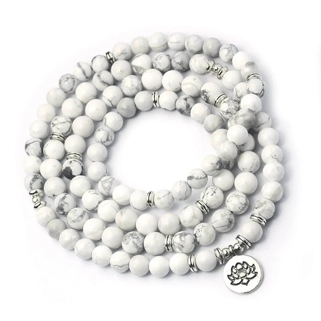 White howlite beaded necklace with silver accents and lotus charm, jewelry accessory