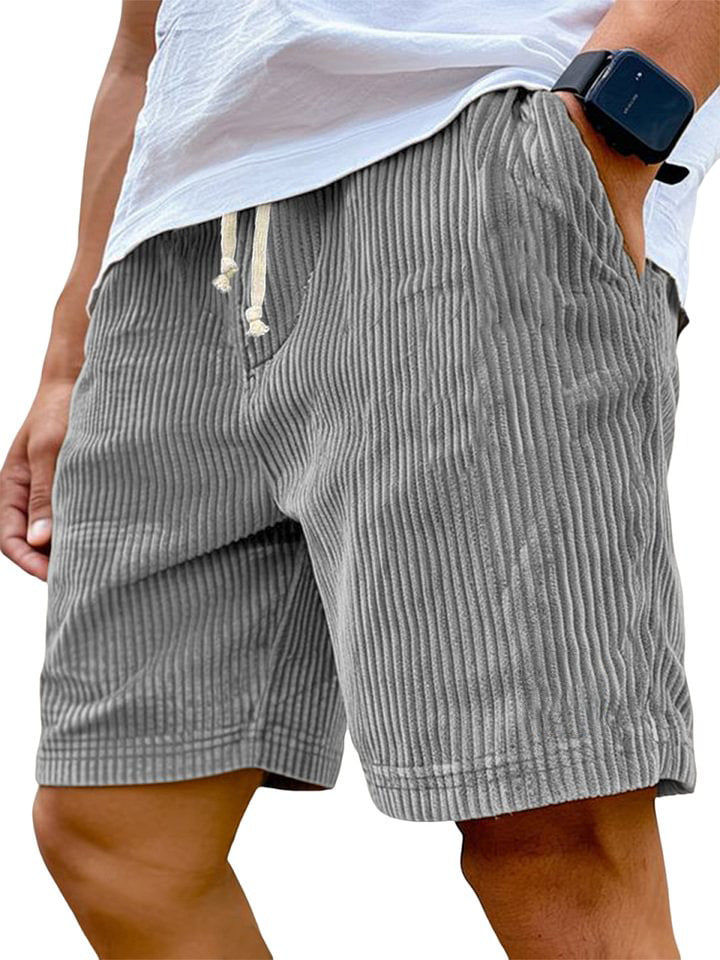 Gray striped shorts worn by a person on a white background