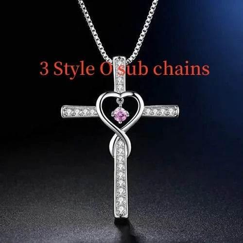 Silver cross heart necklace with pink gemstone pendant, crystal accents, elegant jewelry