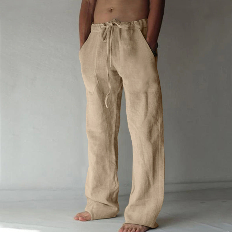 Beige linen pants worn by a person on a plain background