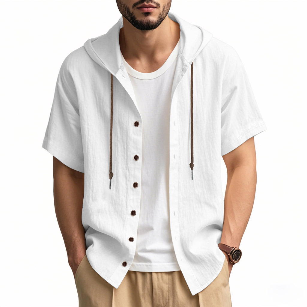 Man wearing a white short-sleeve button-up shirt over a white t-shirt on a white background