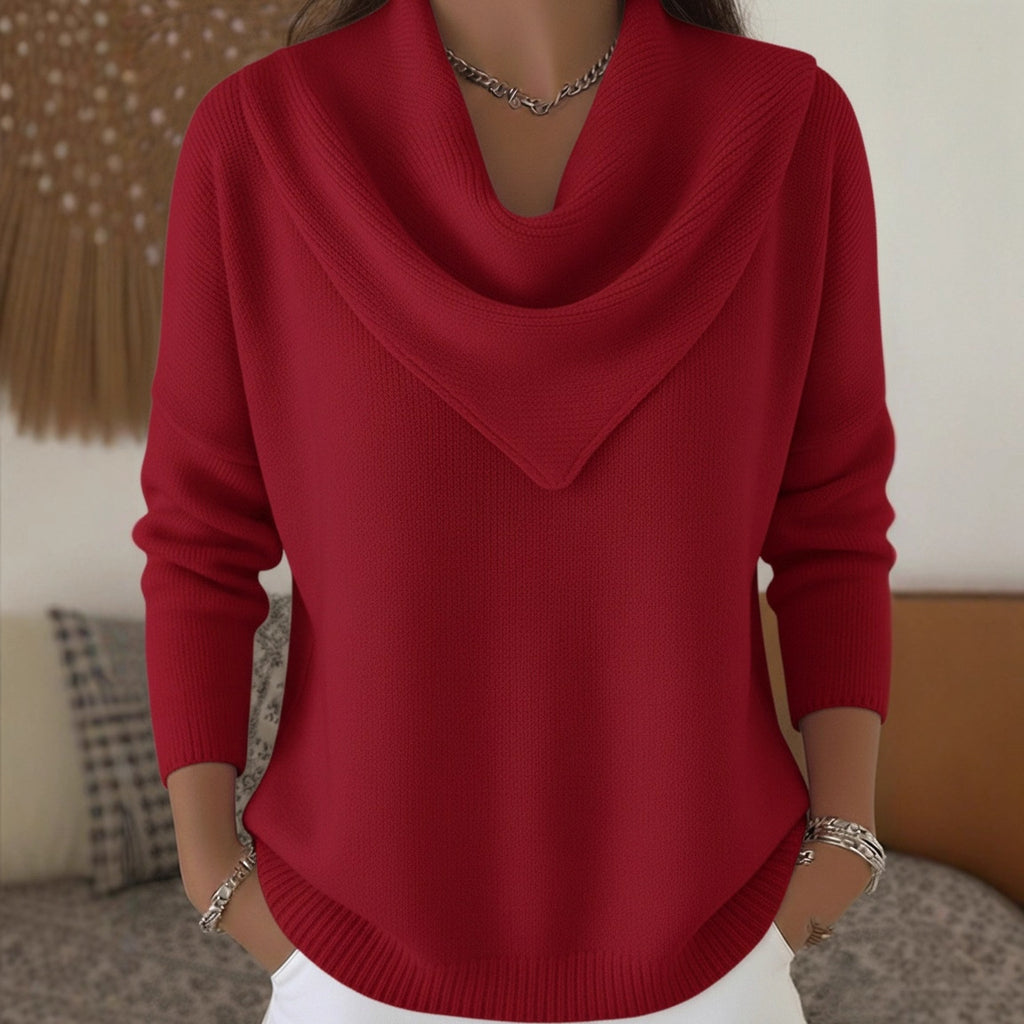 Red sweater worn by a person with a blurred background