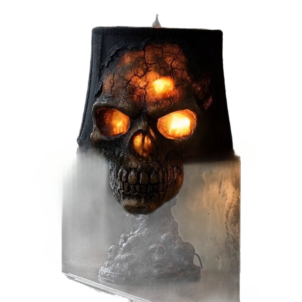 Skull-shaped candle with glowing eyes on a white background