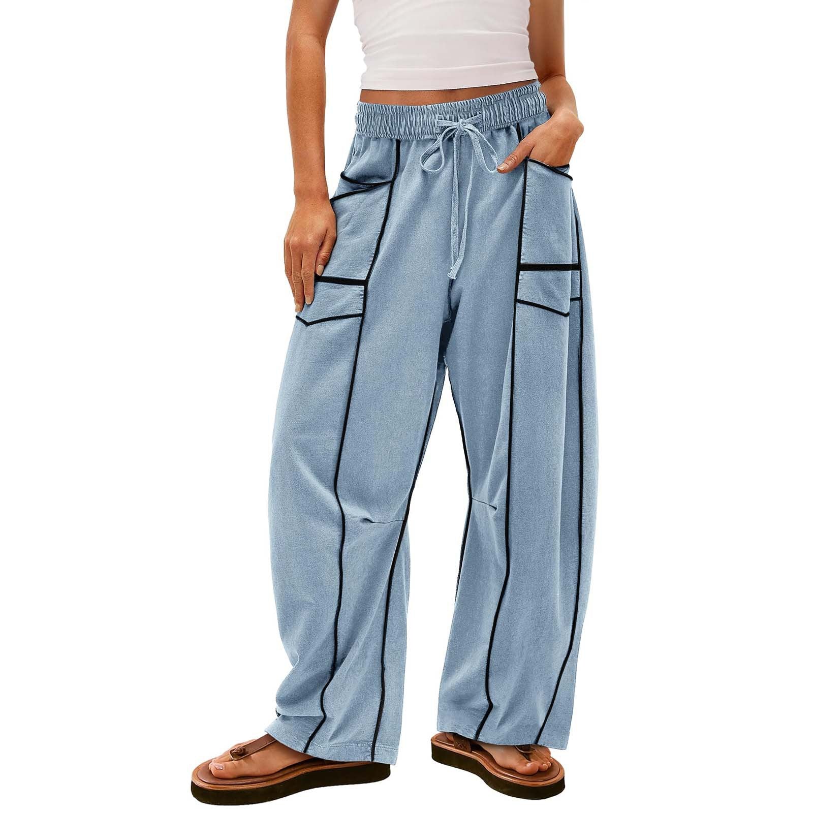 Light blue pants with black accents worn by a person on a white background