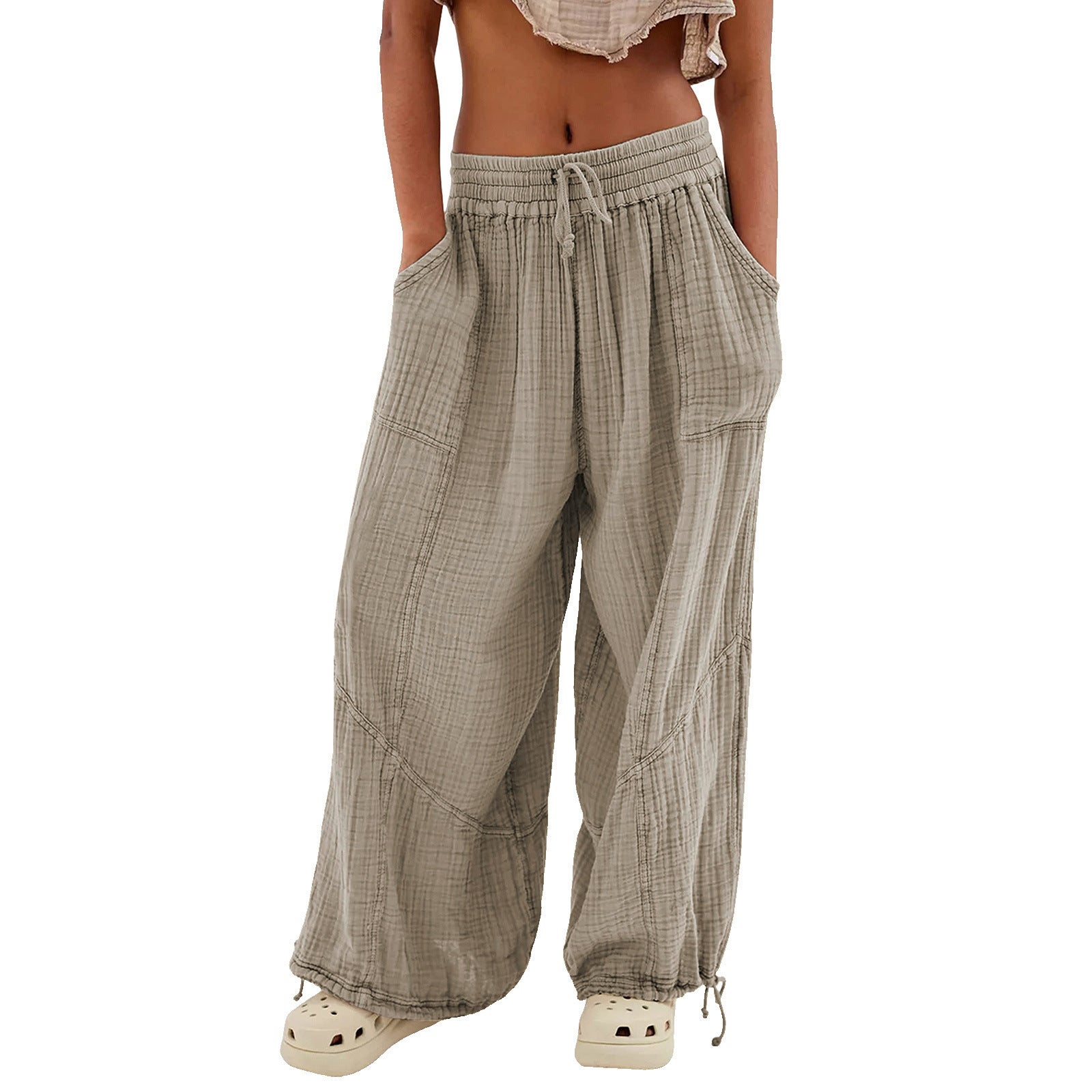 Plaid wide-leg pants worn by a person on a white background