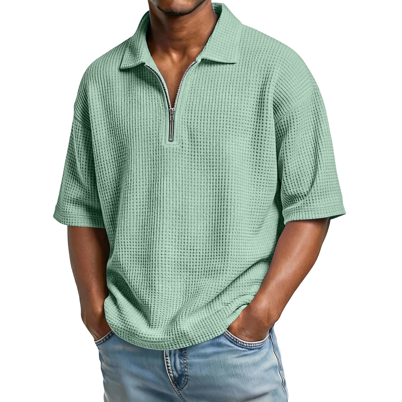 Man wearing a green textured short-sleeve shirt with a zipper on a white background