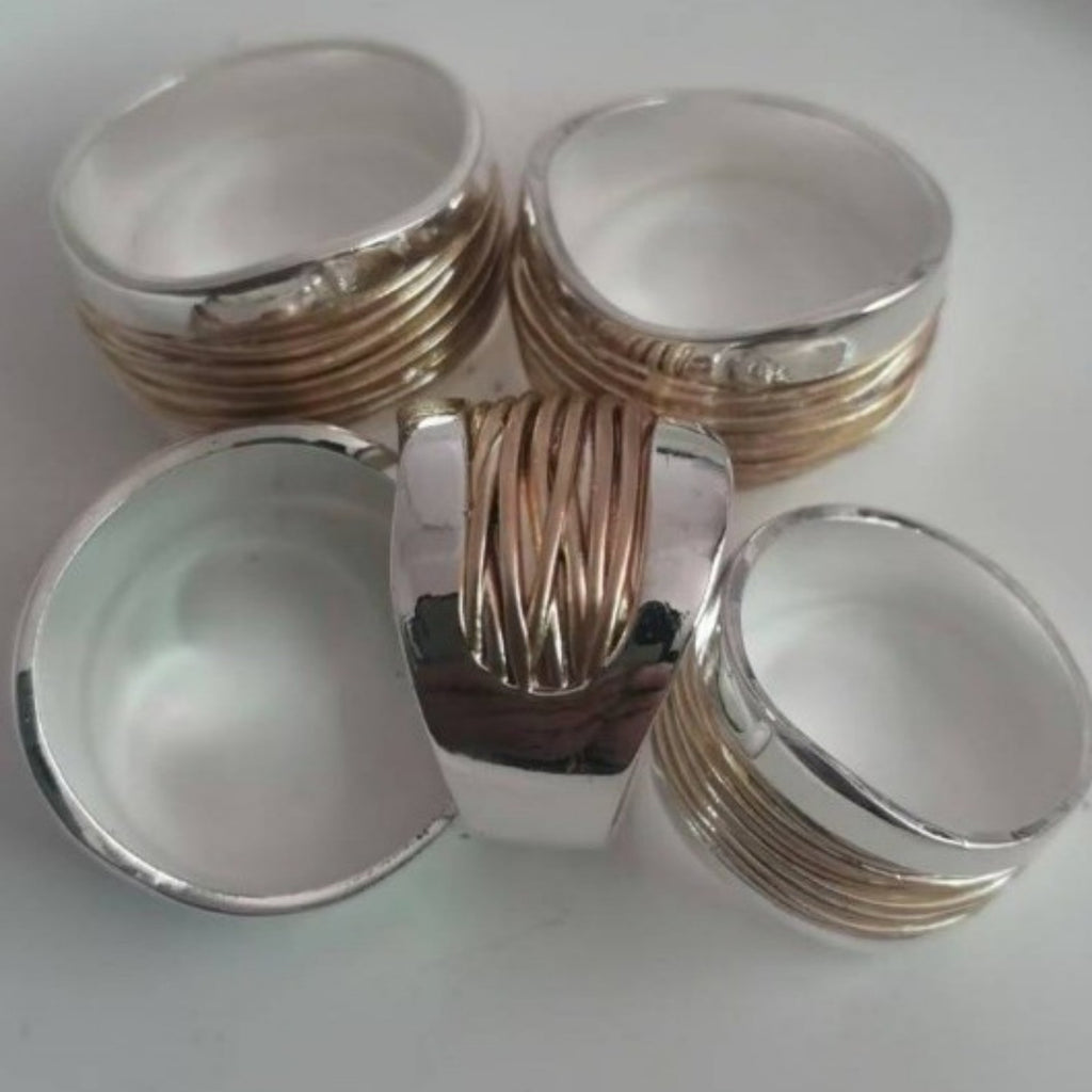 Silver and gold jewelry boxes on a white background
