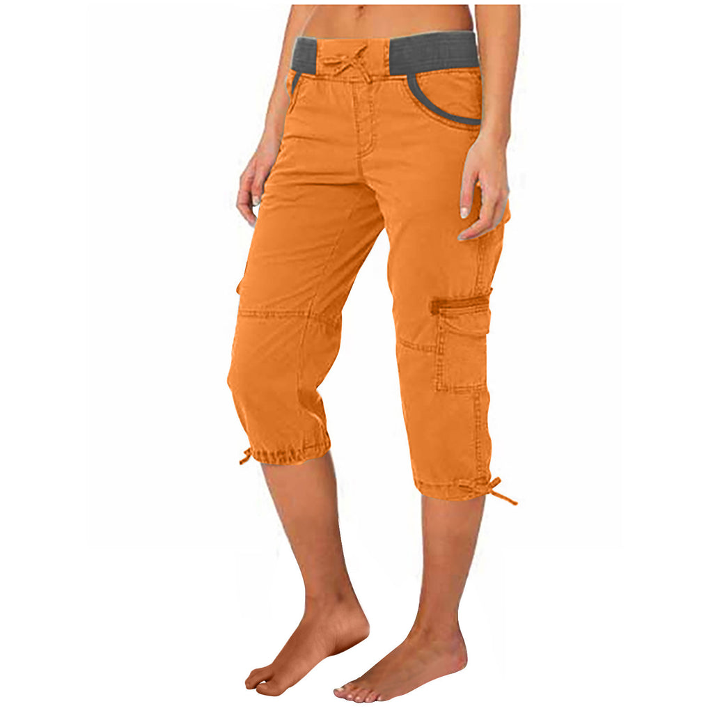 Orange capri pants with a gray belt on a white background