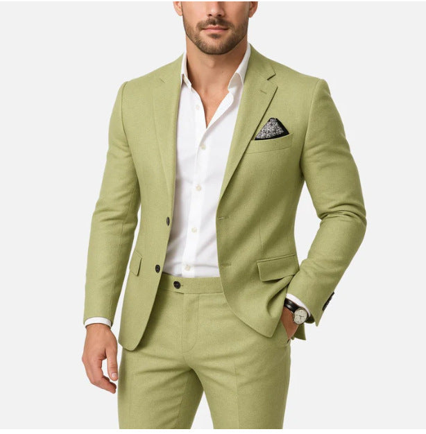 Man wearing a light green suit with a white shirt on a white background