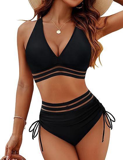 Black bikini set with mesh panels worn by a model on a white background