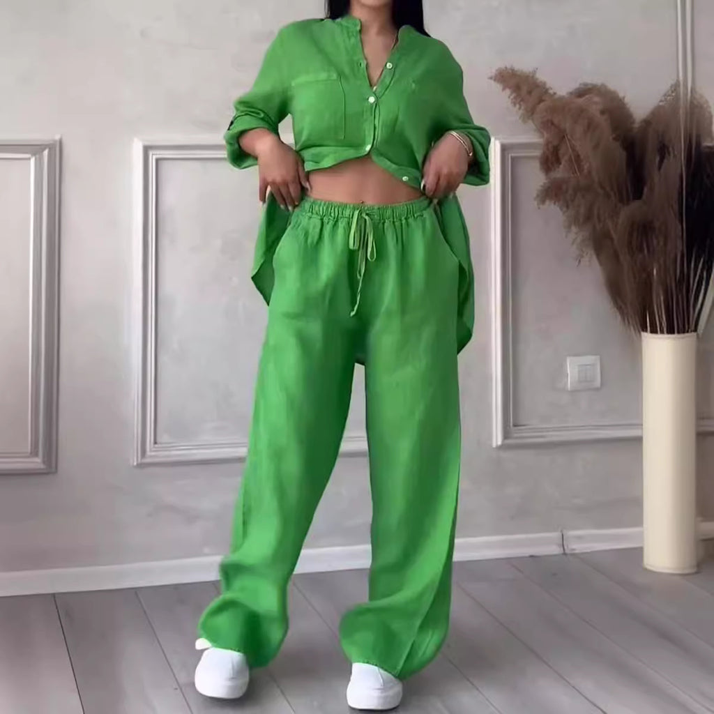 Person wearing a bright green outfit in a room with decorative elements.