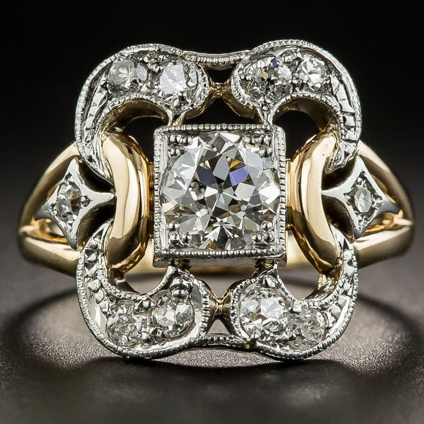 Elegant diamond ring with intricate design on a dark background