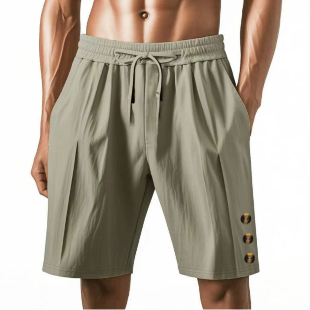 Green shorts with button details on a white background