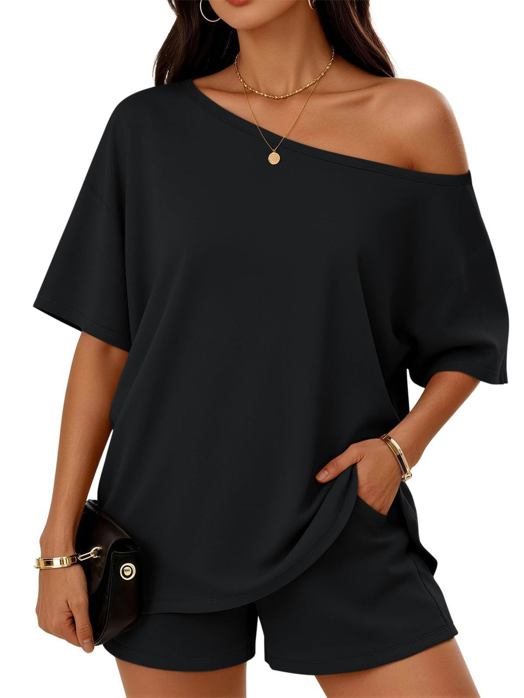 Black off-shoulder top and shorts worn by a model on a white background
