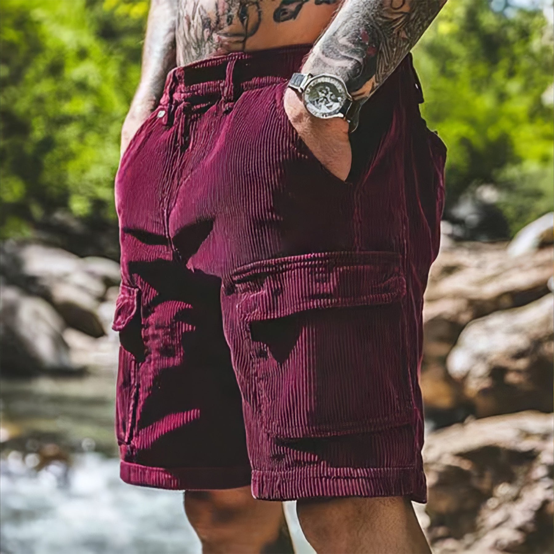 Person wearing maroon shorts with a natural background