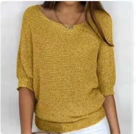 Yellow textured sweater worn by a person on a white background
