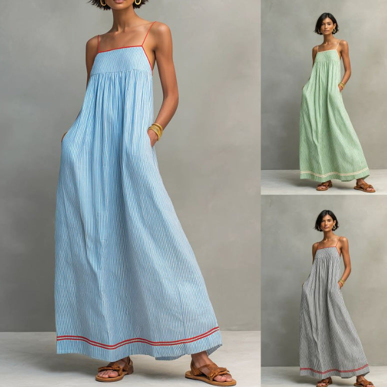 Three women wearing long dresses in blue, green, and gray with red accents against a gray background.