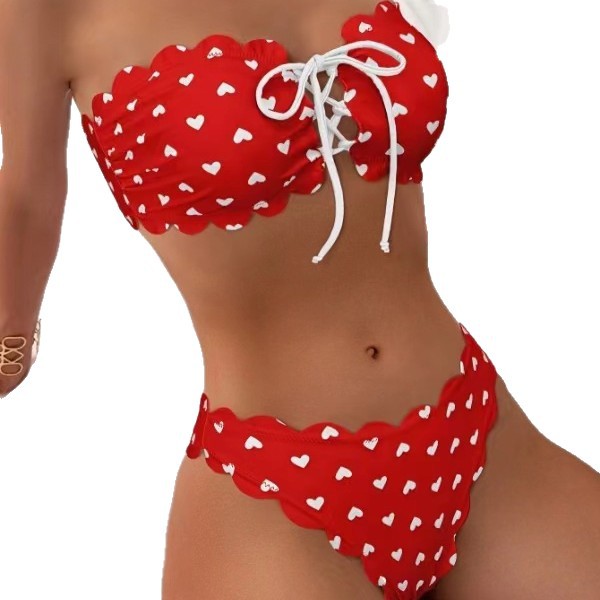 Red bikini with white heart patterns on a white background
