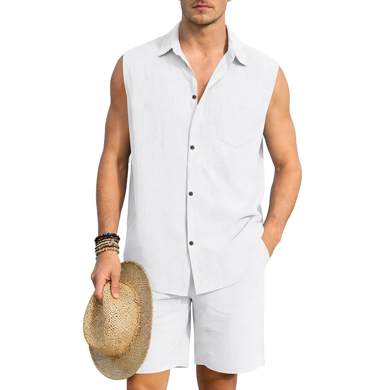 Man wearing a light gray sleeveless shirt and shorts, holding a straw hat on a white background