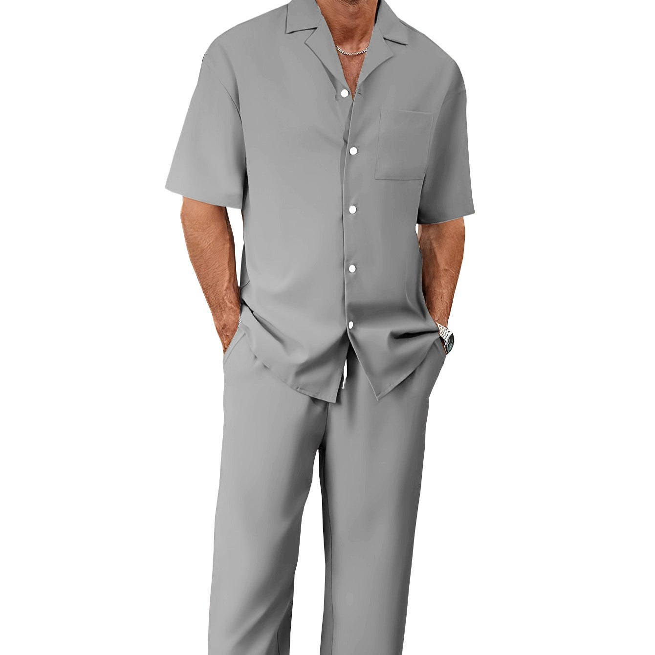 Man wearing a gray shirt and pants set on a white background