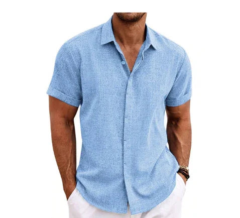 Man wearing a light blue short-sleeve shirt on a white background
