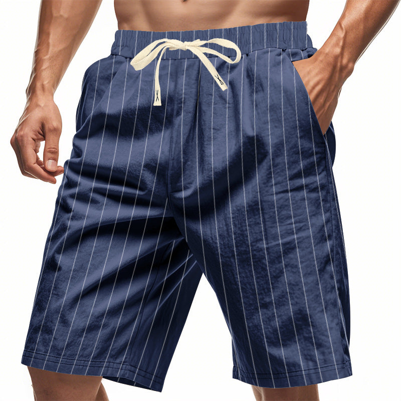 Navy pinstripe shorts with a drawstring on a white background
