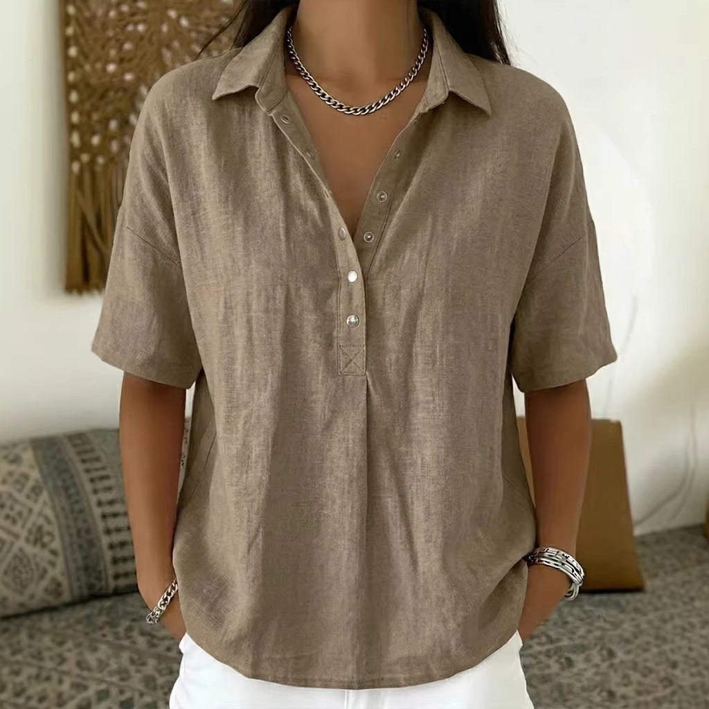 Person wearing a brown button-up shirt with a neutral background