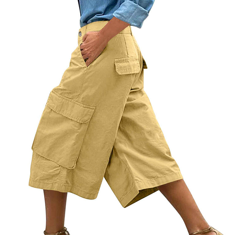 Beige cargo shorts worn by a person on a white background
