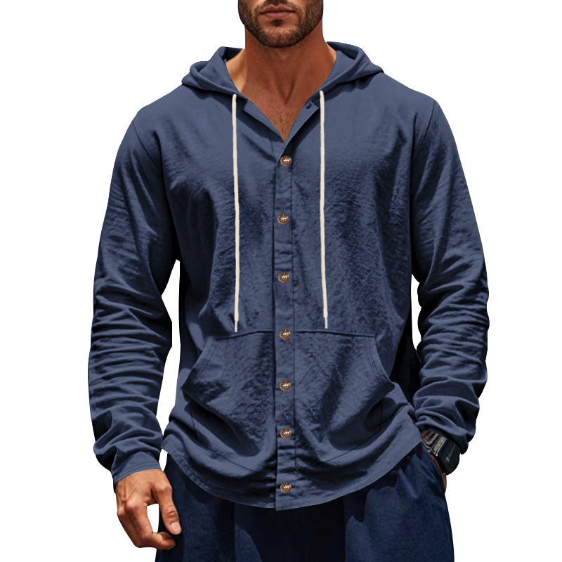 Man wearing a blue hooded jacket with buttons on a white background