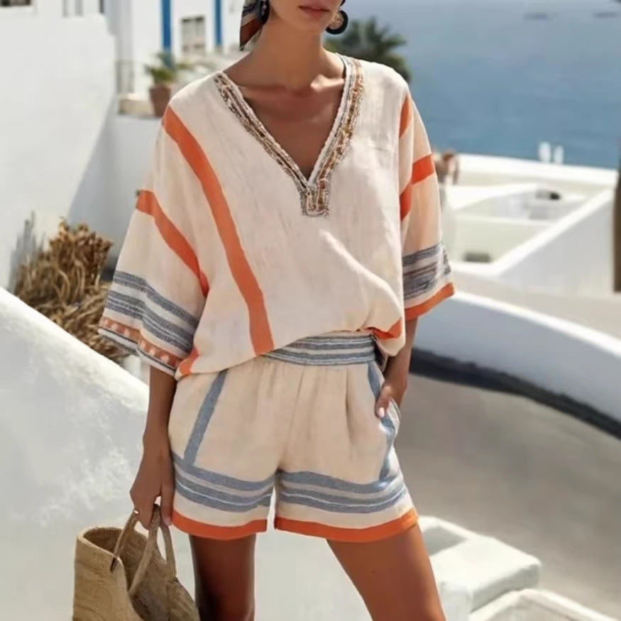 Woman wearing a colorful outfit with a white background and ocean view