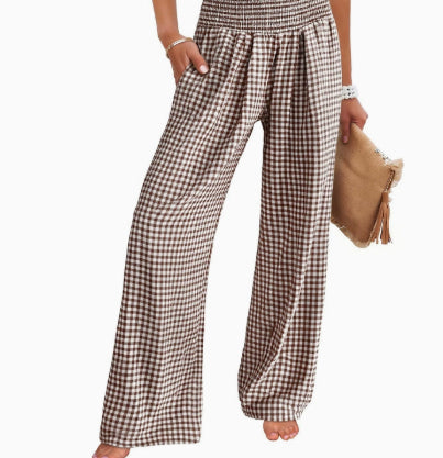 Plaid pants worn by a person on a white background