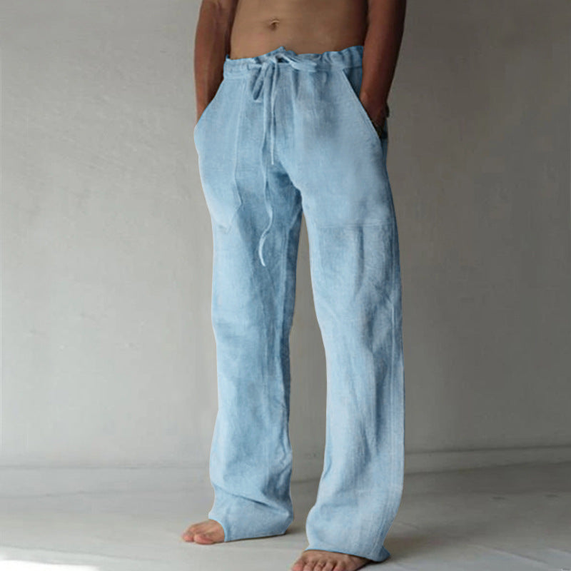 Light blue linen pants worn by a person on a plain background