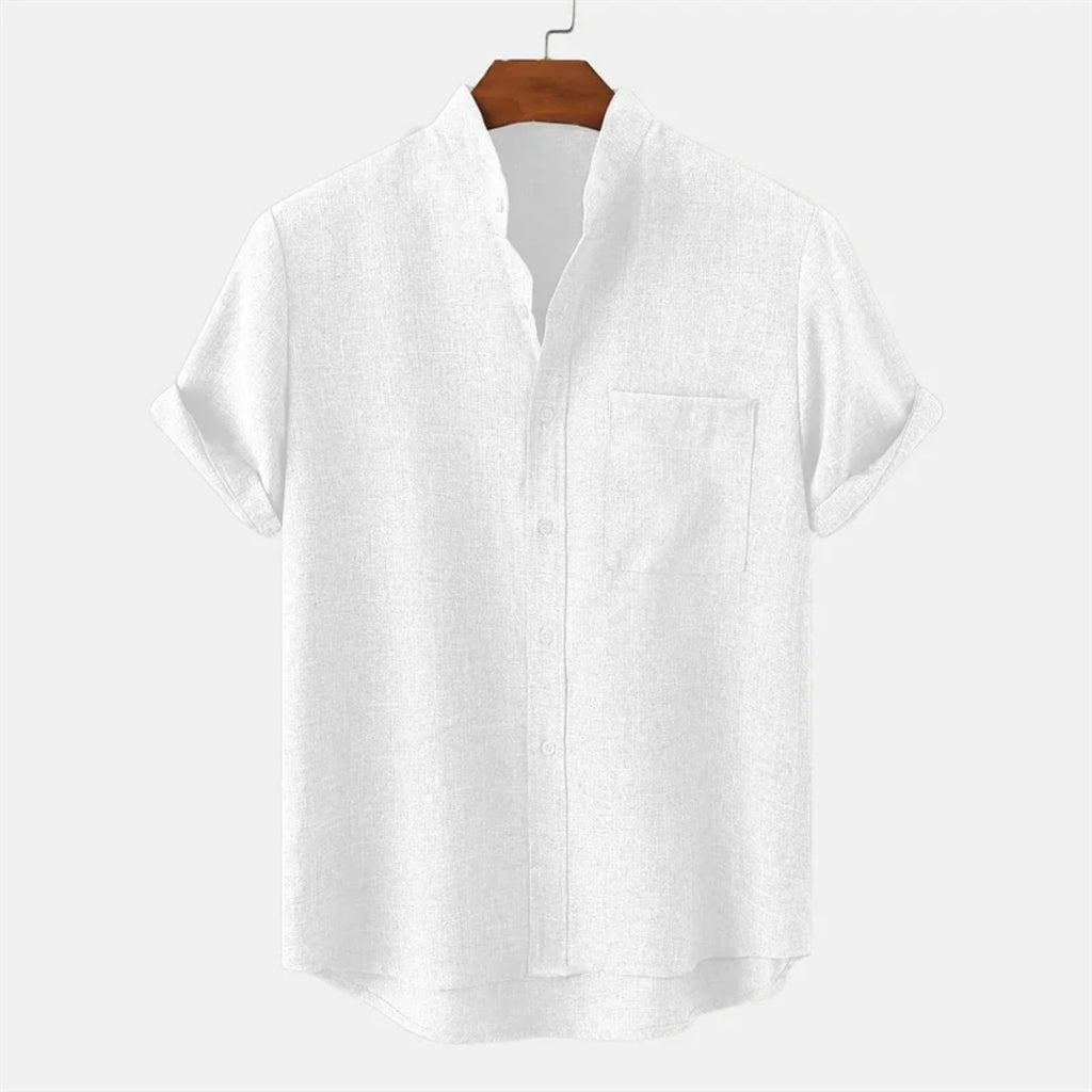 White shirt on a wooden hanger against a white background