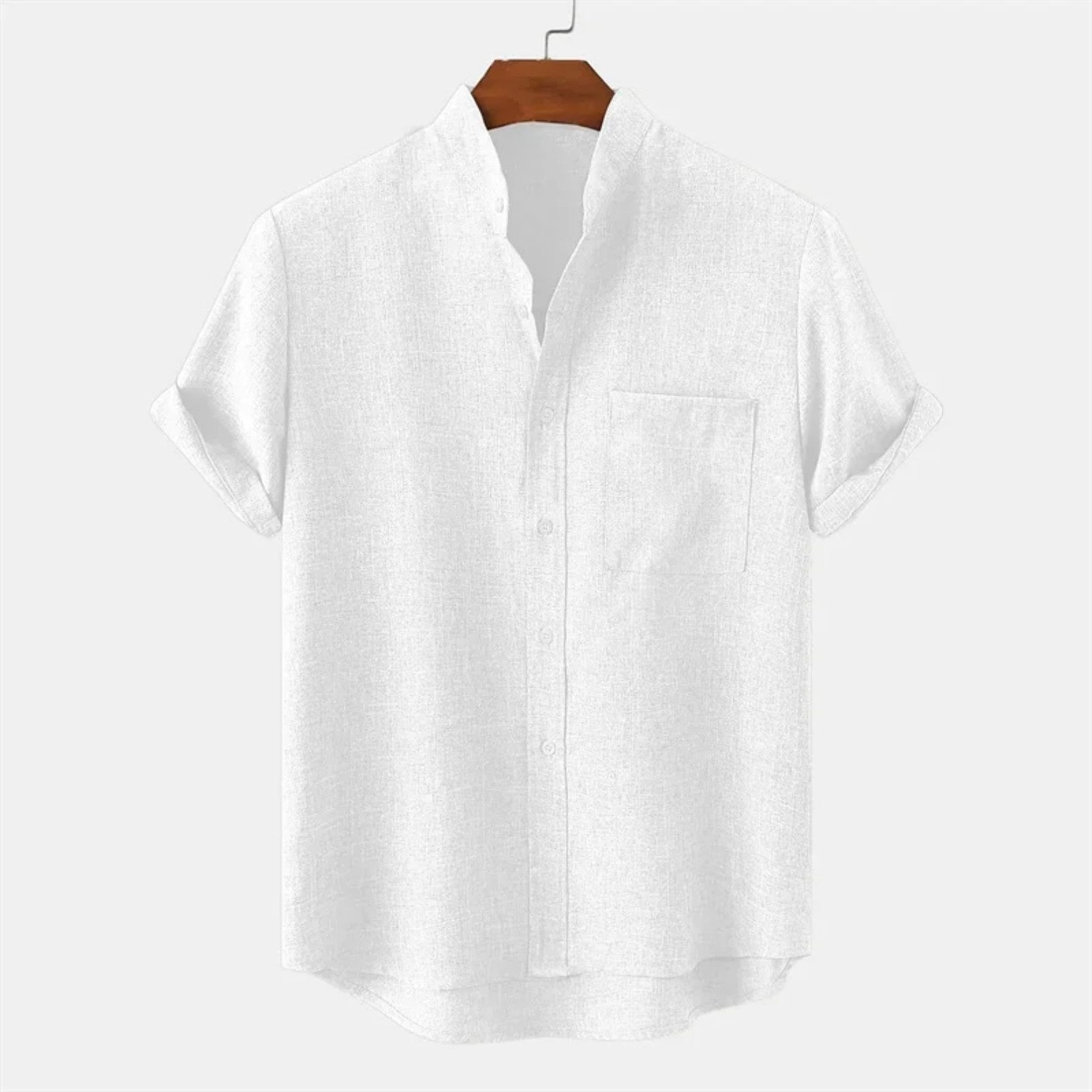 White shirt on a wooden hanger against a white background
