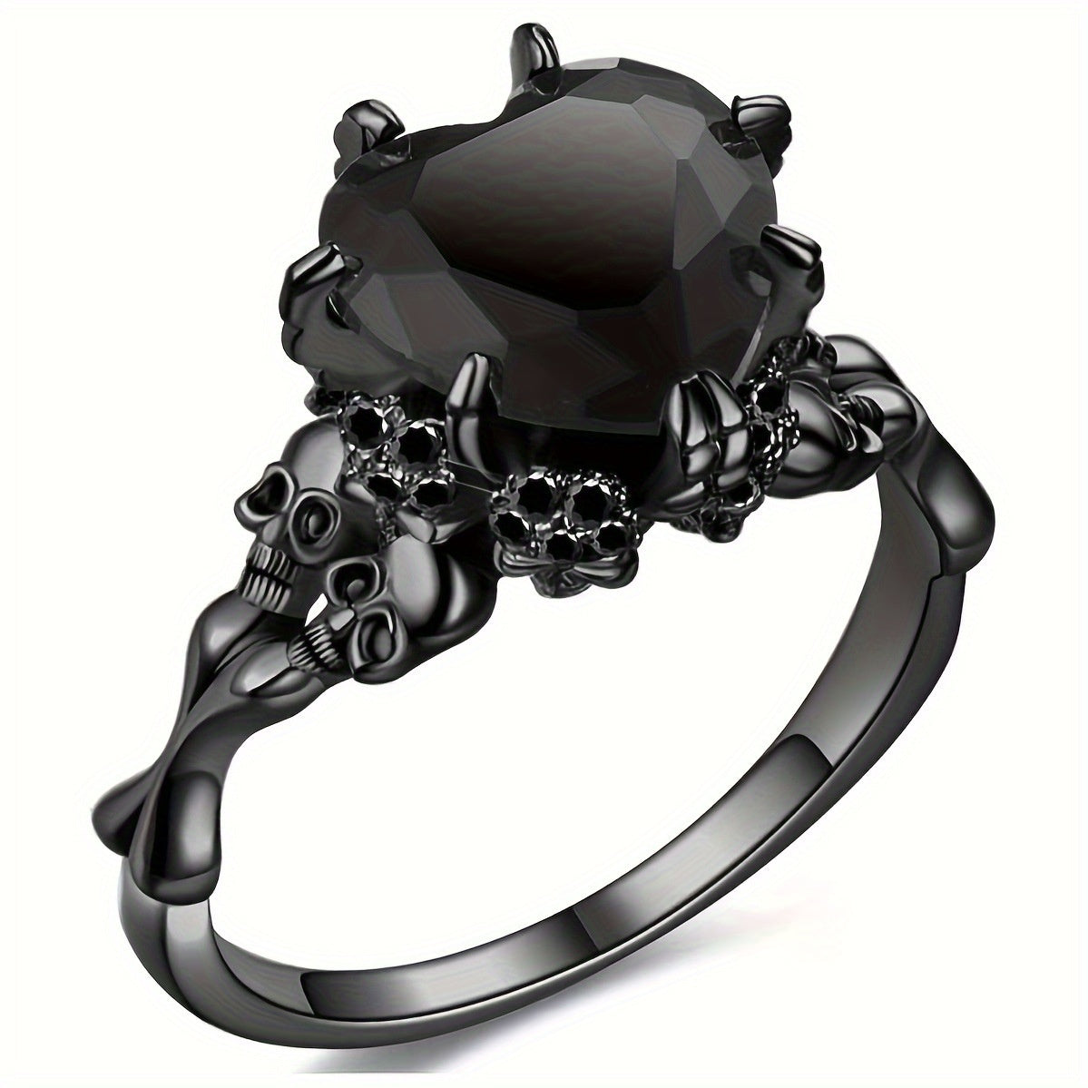 A gothic-style black ring featuring a large faceted black gemstone held by skull and crossbones motifs, set on a polished black band against a white background.