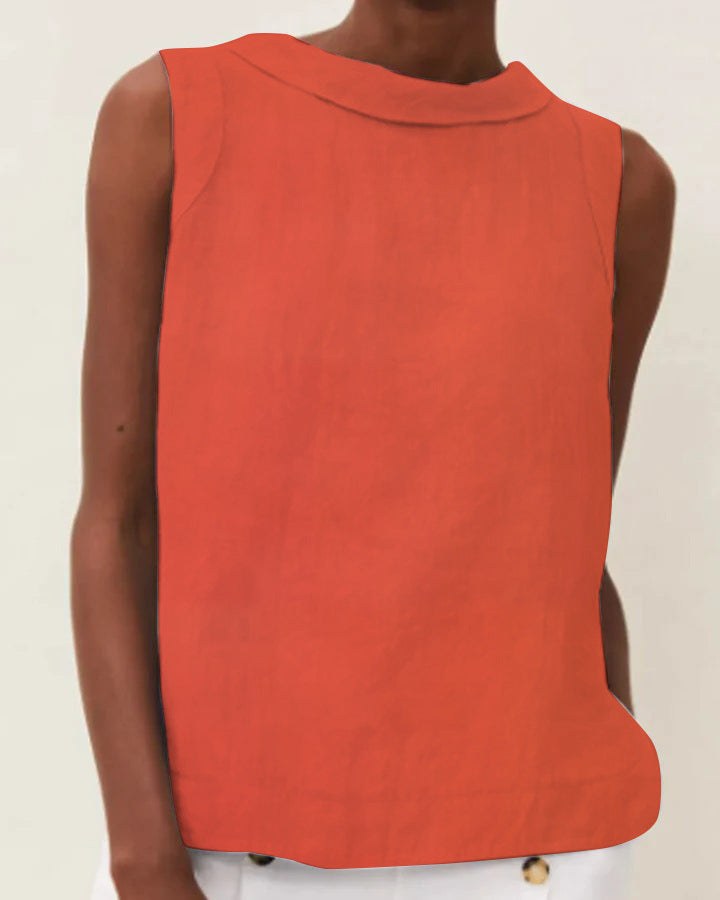 Red sleeveless top worn by a person on a plain background