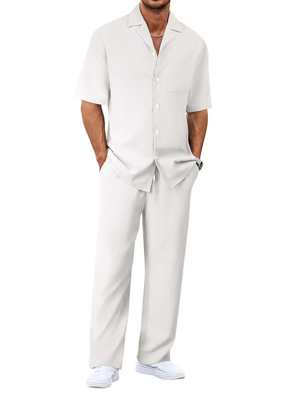 Man wearing a light gray linen suit on a white background