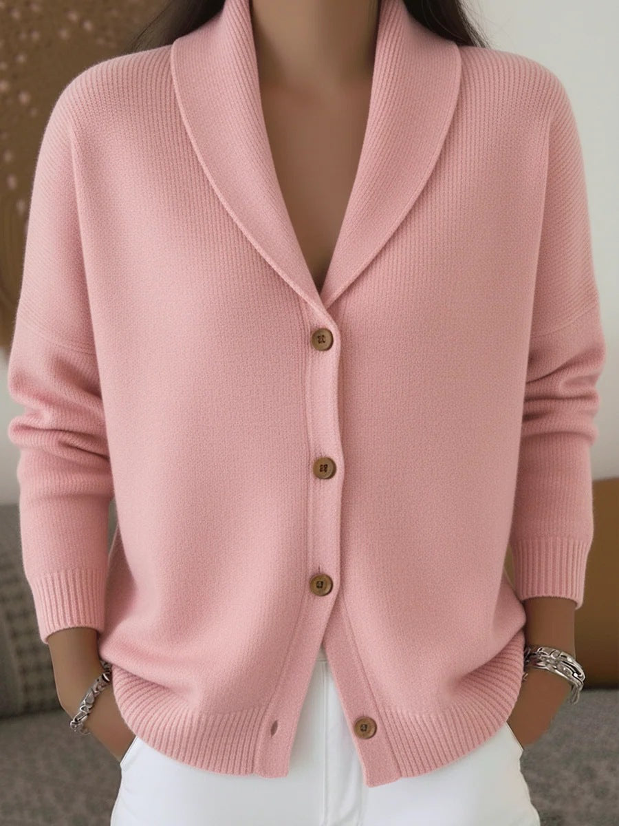 Pink cardigan worn by a person with a neutral background