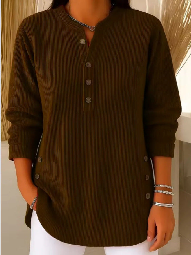 Brown ribbed long-sleeve shirt worn by a person with a neutral background